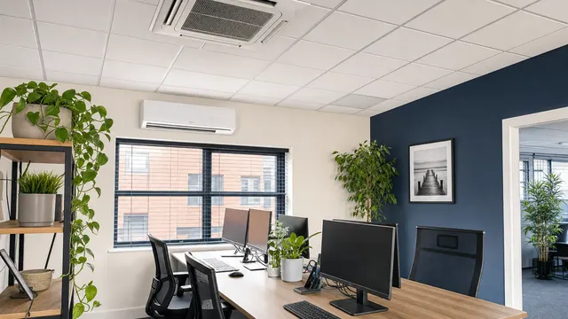 Office with ceiling cassette and wall-mounted air conditioning
